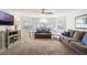 Bright living room with large windows, comfortable sofas, and neutral decor at 2047 Royal Bay Blvd # 21, Kissimmee, FL 34746