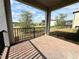 Relaxing outdoor patio space with brick flooring offering views of the landscaped backyard and beautiful sky at 2445 Verde View Dr, Apopka, FL 32703