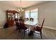 Formal dining area with a large dining table, china cabinet, and sliding glass doors to the outdoor patio at 2445 Verde View Dr, Apopka, FL 32703