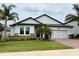 Charming single-Gathering home featuring mature landscaping and a two-car garage at 2445 Verde View Dr, Apopka, FL 32703