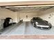 Clean two-car garage with epoxy floors, organized storage, and a modern sports car at 2445 Verde View Dr, Apopka, FL 32703