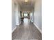 Inviting entryway showcasing neutral walls, stylish flooring, and a glimpse into the living area of this well-maintained home at 2445 Verde View Dr, Apopka, FL 32703