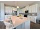 Well-equipped kitchen with stainless steel appliances, sleek countertops, and a central island with seating at 2445 Verde View Dr, Apopka, FL 32703