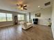 Comfortable living room featuring tile flooring and bright natural light at 2445 Verde View Dr, Apopka, FL 32703
