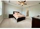 Spacious main bedroom with a tray ceiling, plush carpet, and access to an ensuite bathroom at 2445 Verde View Dr, Apopka, FL 32703