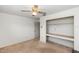 Simple bedroom with neutral walls, a ceiling fan, a closet, and a window for natural light, offering a blank canvas at 2621 Ardon Ave, Orlando, FL 32833