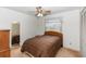 Comfortable bedroom with neutral walls, a window for natural light, closet space and a ceiling fan for relaxation at 2621 Ardon Ave, Orlando, FL 32833