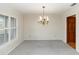 Traditional dining room with a decorative chandelier and shutters at 2621 Ardon Ave, Orlando, FL 32833
