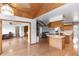 Bright kitchen featuring wood cabinets, an island, and hardwood floors at 2621 Ardon Ave, Orlando, FL 32833