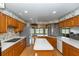 Bright eat-in kitchen with stainless steel fridge, plenty of counter space, and lots of natural light at 2621 Ardon Ave, Orlando, FL 32833