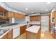 Well-equipped kitchen with modern appliances, island and breakfast bar for casual dining at 2621 Ardon Ave, Orlando, FL 32833