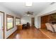 Large living area with an office space, brick fireplace, and big windows at 2621 Ardon Ave, Orlando, FL 32833
