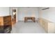 Spacious office with bright neutral carpet, desk and cabinets at 2621 Ardon Ave, Orlando, FL 32833