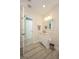 Bathroom with single sink vanity, modern fixtures, and wood-look floors at 3 Poinsettia Dr, Debary, FL 32713