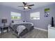 Bedroom features a ceiling fan, windows, and neutral color scheme at 3 Poinsettia Dr, Debary, FL 32713