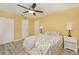 Bright bedroom features a ceiling fan, closet, and a neutral color scheme at 3 Poinsettia Dr, Debary, FL 32713