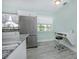 Bright kitchen featuring modern appliances, granite countertops, and a built-in workspace at 3 Poinsettia Dr, Debary, FL 32713