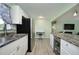 Modern kitchen equipped with stainless steel appliances, granite countertops, and ample cabinet space at 3 Poinsettia Dr, Debary, FL 32713