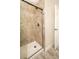 Walk-in shower featuring stylish tile and glass door at 3 Poinsettia Dr, Debary, FL 32713