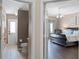 Open doorway reveals a bedroom featuring hardwood floors and a leather chair for comfortable relaxation at 3033 Zaharias Dr, Orlando, FL 32837