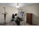 Carpeted workout room with mounted pull-up bar, exercise bike, elliptical machine, and wooden dresser at 3033 Zaharias Dr, Orlando, FL 32837
