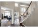 Inviting foyer showcases hardwood floors, a staircase, an office entrance, and an open living area at 3033 Zaharias Dr, Orlando, FL 32837
