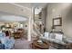 Elegant living room featuring a staircase, dining room view, and comfortable seating area at 3033 Zaharias Dr, Orlando, FL 32837
