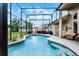 Private screened-in pool with a well-kept garden, outdoor grill, and cozy seating for ultimate outdoor relaxation at 3033 Zaharias Dr, Orlando, FL 32837