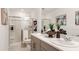 Bathroom featuring double sinks, modern vanity, and glass-enclosed shower at 3116 Skyline Loop, Kissimmee, FL 34758