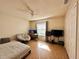 Comfortable bedroom featuring a ceiling fan, desk, and a cozy chair, perfect for relaxing and working at 318 Douglas Way # 87, Winter Garden, FL 34787