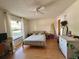 Comfortable bedroom with natural light, fan, and ample space for a relaxing retreat at 318 Douglas Way # 87, Winter Garden, FL 34787