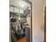 Organized walk-in closet with shelving, hanging rods, and drawers, maximizing storage space at 318 Douglas Way # 87, Winter Garden, FL 34787