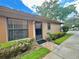 Charming one-story condo featuring well-kept landscaping and a welcoming entrance at 318 Douglas Way # 87, Winter Garden, FL 34787