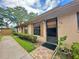 Charming condo with a welcoming front door, tidy landscaping, and neutral exterior paint at 318 Douglas Way # 87, Winter Garden, FL 34787