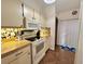Well-maintained kitchen with ample counter space and a convenient stove top at 318 Douglas Way # 87, Winter Garden, FL 34787