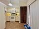 Functional kitchen layout with updated appliances and easy access to the dining area at 318 Douglas Way # 87, Winter Garden, FL 34787