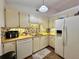 Clean kitchen featuring bright cabinets, modern appliances, and stylish tile backsplash at 318 Douglas Way # 87, Winter Garden, FL 34787