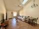 Bright living room with vaulted ceilings, skylight, and cozy seating area at 318 Douglas Way # 87, Winter Garden, FL 34787