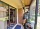 Enclosed porch with sliding glass doors, storage closet, and room for outdoor equipment, perfect for relaxation at 318 Douglas Way # 87, Winter Garden, FL 34787
