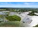 Aerial view of a lake with marshland at 3666 Maidencain St, Clermont, FL 34714