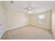 Bright bedroom features neutral carpet and ceiling fan at 3666 Maidencain St, Clermont, FL 34714