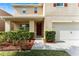 Charming two-story home featuring a covered front porch and well-manicured landscaping at 3666 Maidencain St, Clermont, FL 34714