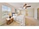Main bedroom featuring a ceiling fan, natural light and neutral color tones, creating a peaceful retreat at 3666 Maidencain St, Clermont, FL 34714
