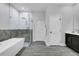 Beautiful bathroom featuring a standalone tub, glass-enclosed shower, and modern fixtures at 3764 Rachel St, Apopka, FL 32703