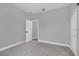 Neutral bedroom featuring carpeted floors, white trim and a double closet at 3764 Rachel St, Apopka, FL 32703