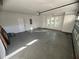Spacious two car garage with ample natural light and painted floor at 3764 Rachel St, Apopka, FL 32703