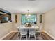 Charming dining room featuring a white table and chairs, perfect for entertaining guests or enjoying Gathering meals at 381 Red Mulberry Ct, Longwood, FL 32779