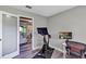 Office area featuring a Peloton bike and access to the rest of the home at 381 Red Mulberry Ct, Longwood, FL 32779