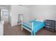 Well-lit bedroom featuring plush carpeting, a functional closet, and clean design at 4951 Alita Ter, St Cloud, FL 34769