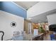 Spacious dining room with high ceilings, modern decor, and seamless flow into the kitchen at 4951 Alita Ter, St Cloud, FL 34769